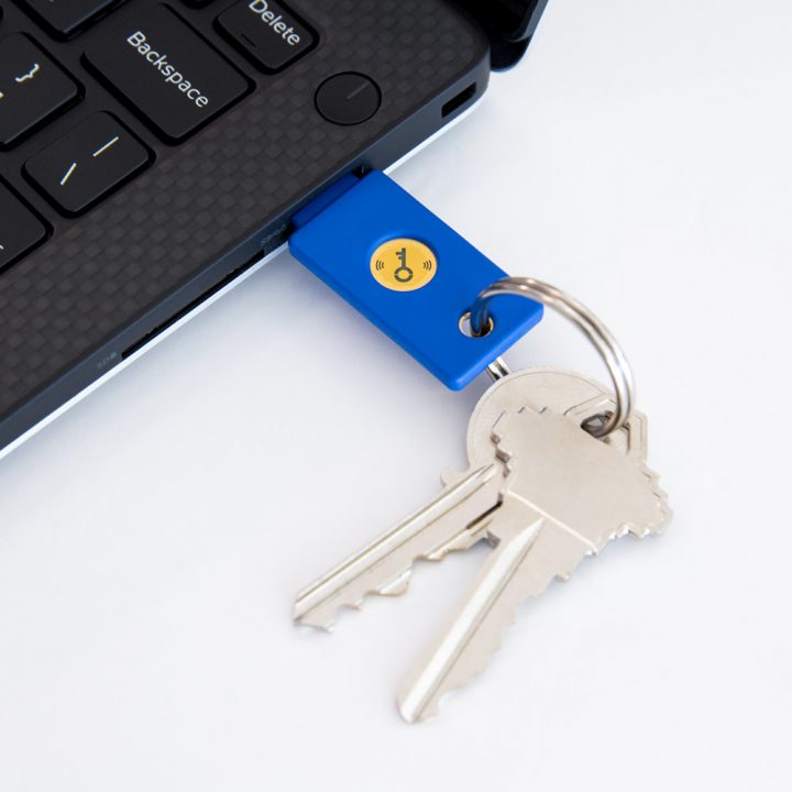 Security Key NFC on a keychain plugged into a laptop