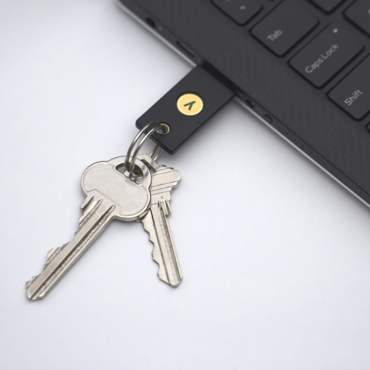 YubiKey FIPS on a keychain plugged into a laptop